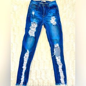 Distress skinny blue jeans